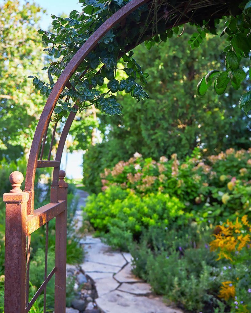 Country home landscaping arched trellis
