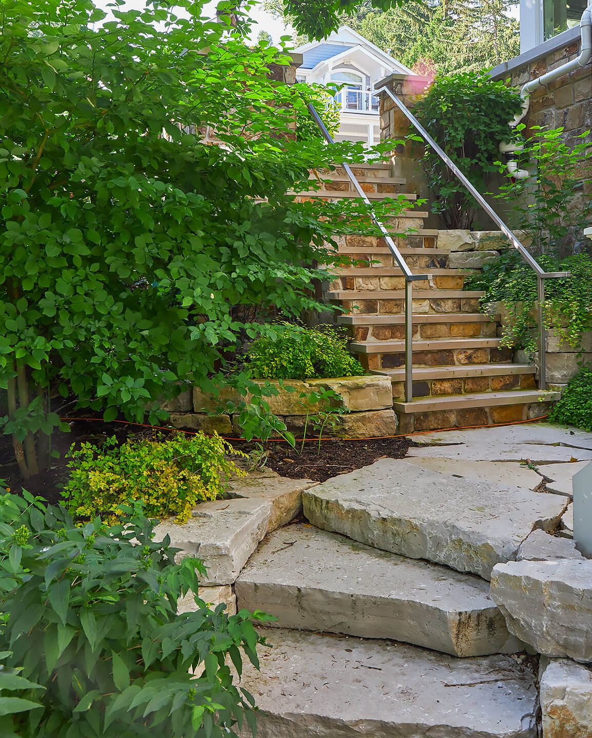 giant stone paver staircase a lakefront home